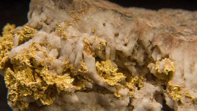 closeup-shot-of-native-gold-isolated-on-a-black-ba-2023-03-03-02-54-58-utc