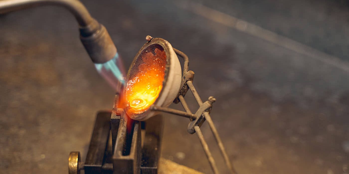 goldsmith-using-a-blowtorch-for-the-metalwork-2021-09-03-14-17-35-utc